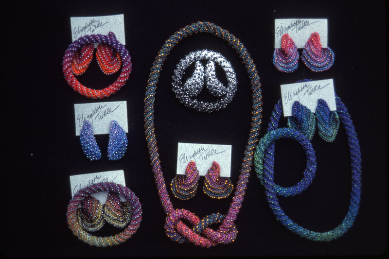 Elizabeth Tuttle, Assorted Rope Collars, Bracelets and Earrings.  Crocheted cotton sewing thread with glass beads.
