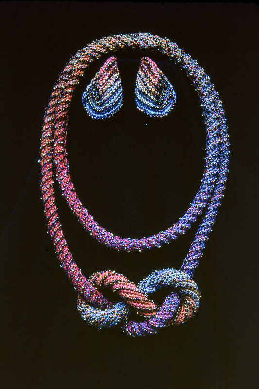 Elizabeth Tuttle, Dark Red and Blue Rope Collar, Bracelet and Earrings. Crocheted cotton sewing thread with glass beads.